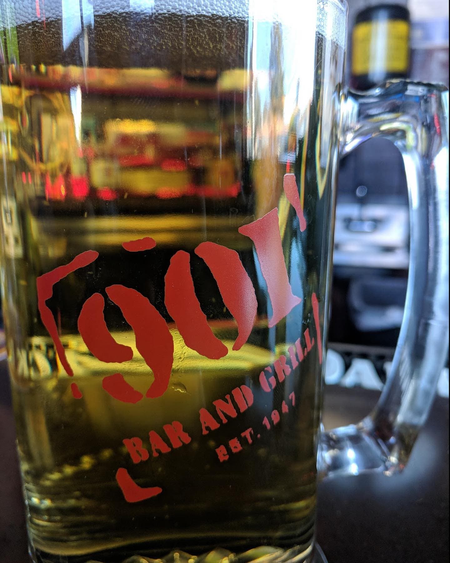 A frosted 901 Bar and Grill mug stamped EST 1947